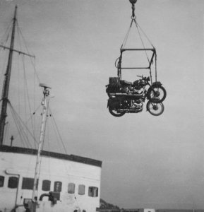 Two bikes being hoisted aboard at Dover pic
